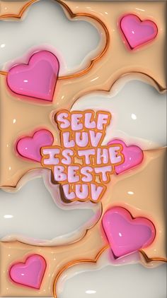 there are hearts on top of the cookies that say self love is the best joy