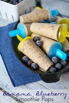 an assortment of ice creams and blueberries on a plate