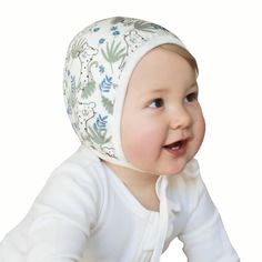 Highlights Premium bamboo cotton. Natural and practical. This fabric can be worn for long periods of time and becomes softer with every wash. For a comfortable fit we utilized a unique two-piece cut to reduce the number of seams and to ensure our bonnets are comfortable for every baby. Reversible bonnet. You can choose white or print side and get two looks in one piece. For any season. You can use our infant bonnet in both warm and cool weather. For colder weather, the bonnet can be layered under a warmer hat. The bonnet for baby girls and boys comes in decorative packaging. It’s a lovely gift for a baby shower, a family expecting a baby, a christening, new parents or that "home from the hospital" outfit. Hypoallergenic and gentle on delicate skin. Our bonnets are made from premium bamboo Newborn Baby Bonnet, Newborn Hospital Hats, Expecting A Baby, Hospital Outfit, Newborn Hospital, Baby Bonnets, Baby Bonnet, Newborn Hat, Expecting Baby