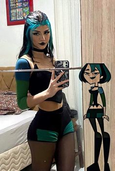 a woman with blue hair is taking a selfie in front of a mirror and holding a camera