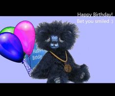 a black teddy bear holding two balloons