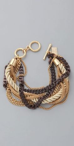 the multi - stranded bracelet is gold and brown