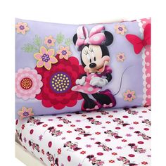 a minnie mouse bedding set with pink and purple flowers