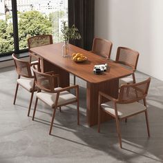 a wooden table with chairs around it