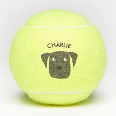 a close up of a tennis ball with a dog's face drawn on it