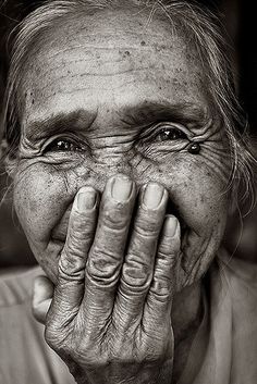 an old woman covering her face with her hands and the words if only our eyes saw souls instead of bodies how very different our ideas would be