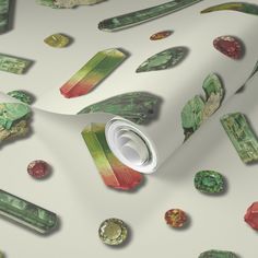 a white wallpaper with green and red items on it