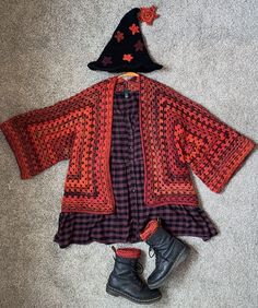 a child's dress and hat laying on the floor