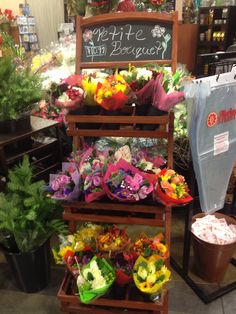 flowers are on display in a flower shop