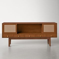 the sideboard is made from wood and has wicker panels on it's sides