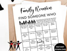 a family reunion game is shown on top of a table next to some paper and scissors
