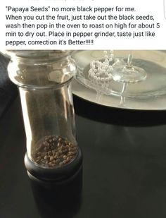 a glass jar filled with food sitting on top of a table next to a plate