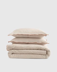 three pillows stacked on top of each other