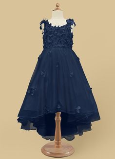 Your flower girl will look pretty like a princess in Ceres, our floral tulle Ball-Gown dress. She features a lace bodice and straps adorned with 3D flowers, a frilly tulle high-low skirt, and a beautiful matte satin bow at the back. Dark Blue Flower Girl Dress, Navy Blue Flower Girl Dress, Navy Blue Flower Girl Dresses, Blue Flower Girl Dress, Navy Blue Girls Dress, Flower Girl Dresses Navy, Blue Flower Girl, Flower Girl Dresses Blue, Girls Blue Dress