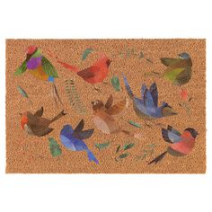 a door mat with birds on it and leaves around the edges, all painted in different colors