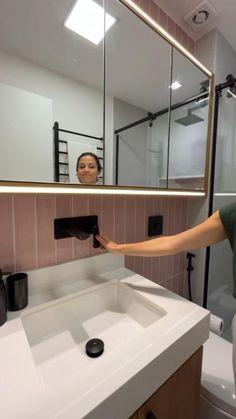 a woman is taking a selfie in the mirror