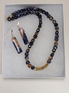 I made this beautiful gemstone necklace using Orange Sodalite which you don't see a lot and makes it unique. The stones are faceted and I used faceted gold spacers giving this necklace lots of shine. It's a great gift for someone special. The listing includes matching earrings. All the components are 14 k gold filled including the ear wires. I am including a care card and a gift box. Care Card, Saint Louis, Gemstone Necklace, Matching Earrings, Ear Wires, Gold Filled, Mothers Day, Gift Box, Beaded Necklace