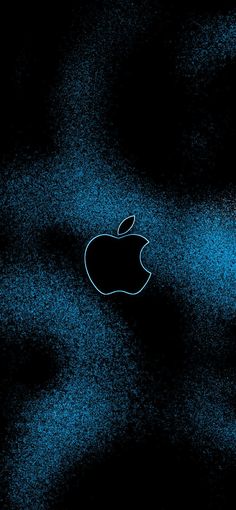 an apple logo on a black background with blue speckles in the dark sky