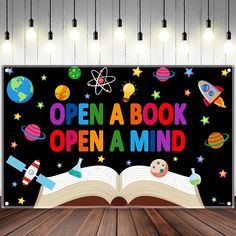 an open book with the words open a book, open a mind in front of it