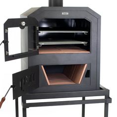 an outdoor wood burning oven with the door open