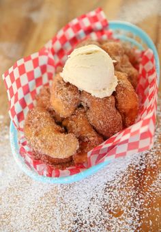 a basket filled with donuts covered in icing