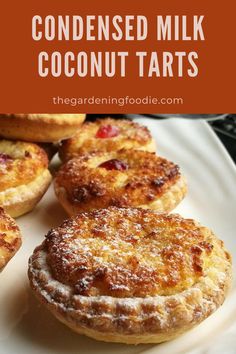 homemade coconut milk coconut tarts on a white plate with text overlay that reads, condenseed milk coconut tarts