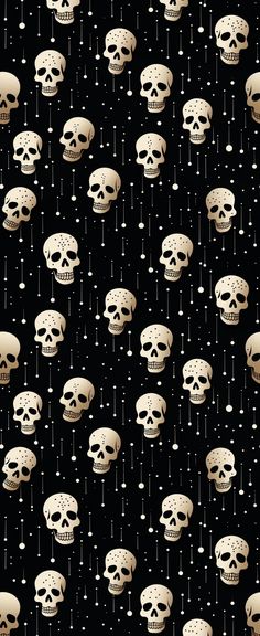 a bunch of skulls that are on a black background with white dots and stars in the sky