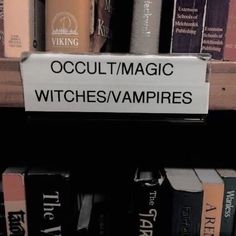 there is a sign that says occultmagic witches / vampires on the shelf