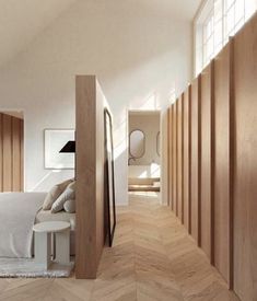 a bedroom with wood paneling and white walls