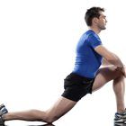 a man in blue shirt and black shorts doing squats on a skateboard with one leg up