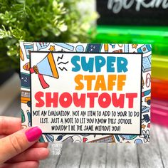 a hand holding up a card with the words super staff shotovt on it