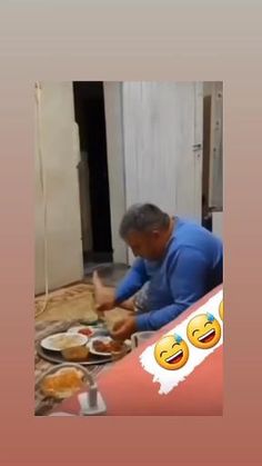 a man sitting at a table with plates of food