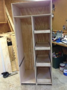 an unfinished closet is shown in the process of being built