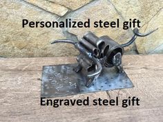 a metal sculpture with the words, personalized steel gift engraved steel gift on it