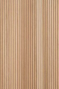 a close up view of the wood grains on a door paneled with vertical stripes