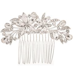 a hair comb with crystal stones and leaves on it's side, in silver