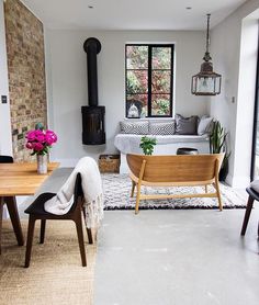 a living room filled with furniture and a fire place