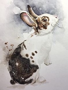 a watercolor painting of a rabbit sitting in front of a white background with brown spots