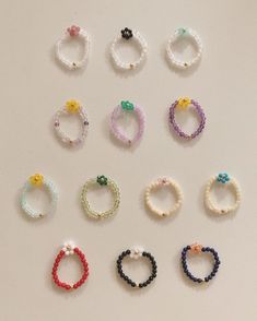 several bracelets are arranged on a white surface
