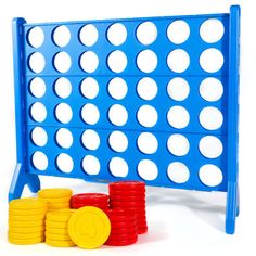 a blue board game with stacks of coins next to it on a white background,