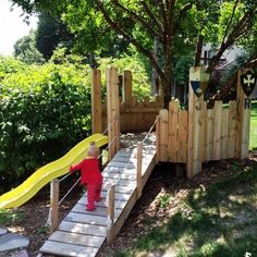 a kid playing on a wooden slide in the yard with text overlay that reads build a kids'castle your neighbors will love