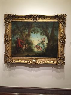 a painting hanging on the wall in a museum