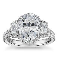 an oval and pear shaped diamond engagement ring