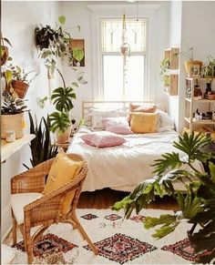 a bedroom with lots of plants in it