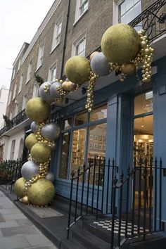 an outside view of a store with christmas decorations