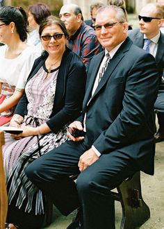 a group of people sitting next to each other