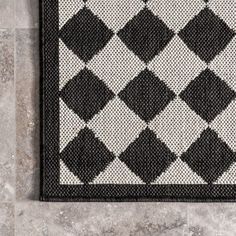 a black and white rug on the floor