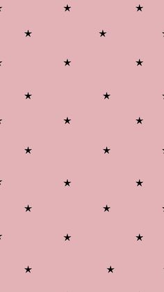 a pink background with black stars on it