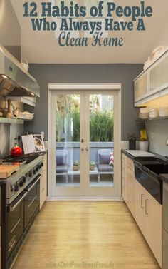 a kitchen with an open door leading to the outside