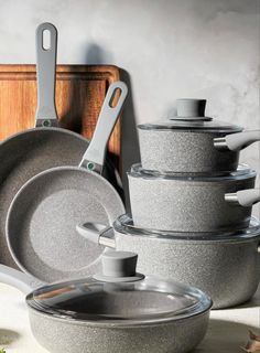 an assortment of pots and pans on a counter